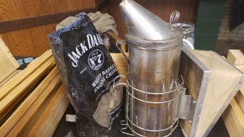 Bee smoker with some old Jack Daniels barrel chips.  Don't just calm your bees give 'em a buzz.